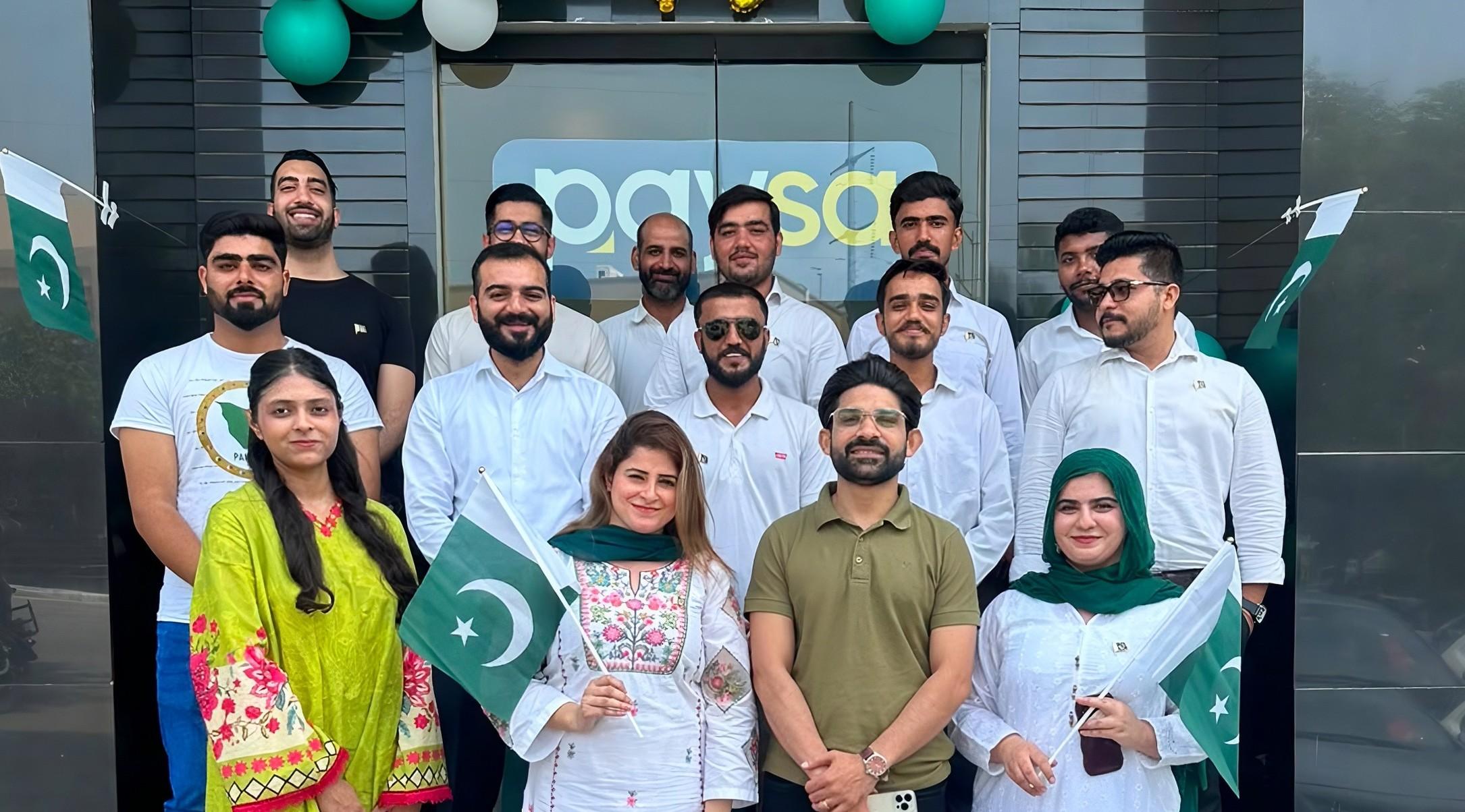 The PaySa team celebrating together at the office